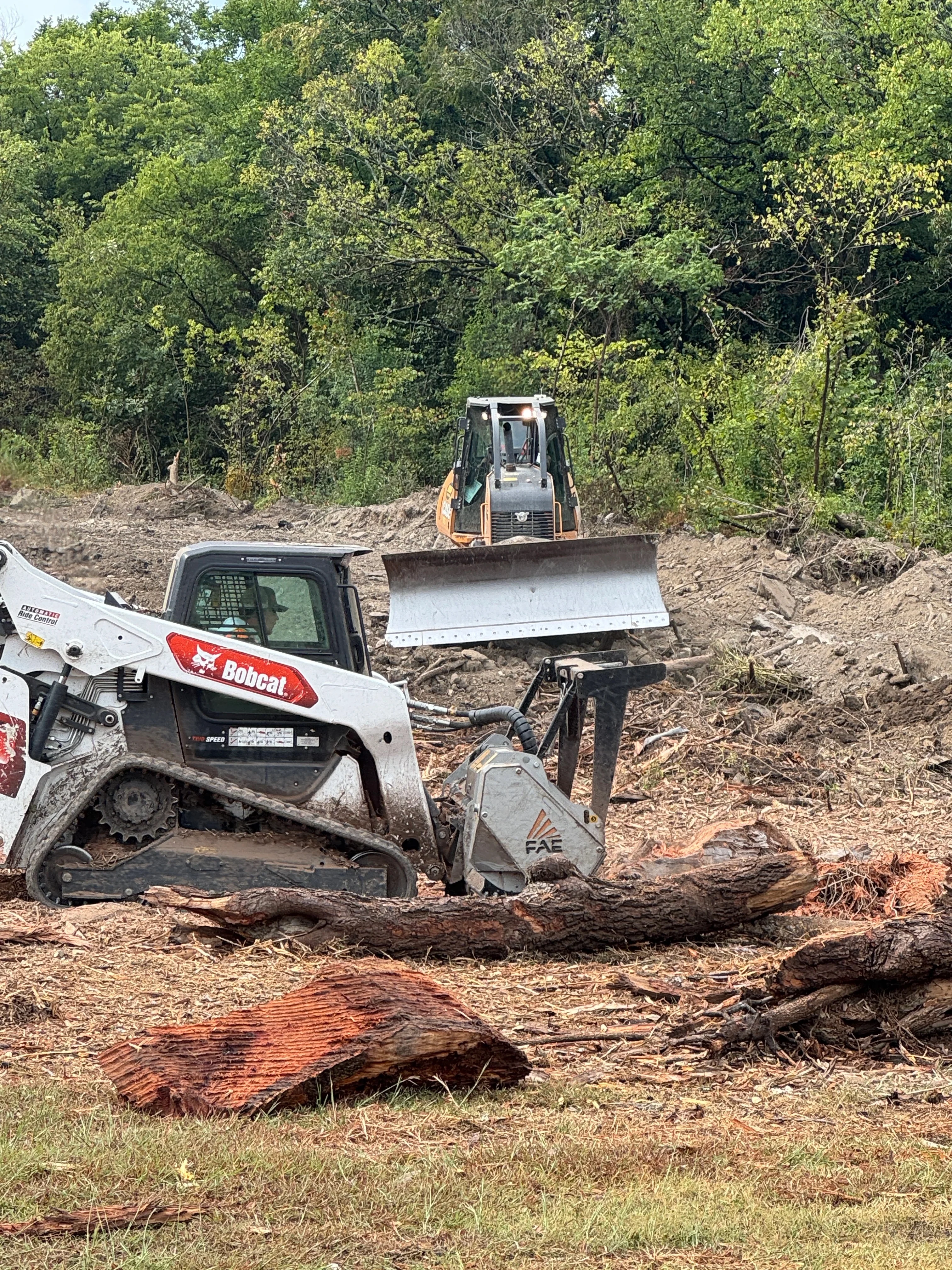 A Dallas vacant lot after overgrown property cleanup by Patriot Equipment and Landworks, showing cleared ground with brush, scrub, and tall weeds fully removed. The land is open, level, and accessible with no remaining debris or invasive growth.